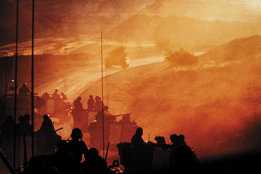 An Israeli armored brigade approaches the Golan Heights to relieve forces under Syrian attack on day two of the 1973 Arab-Israeli War. U.S. fears that the Soviet Union would send troops to assist Egypt and Syria sparked a DEFCON level increase.