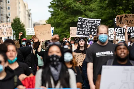 Protestors march through the streets of D.C. during demonstrations over the death of George Floyd, who died in police custody.