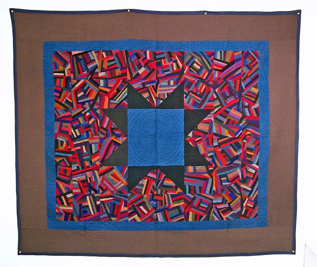 Colorful handmade quilt with a star motif.