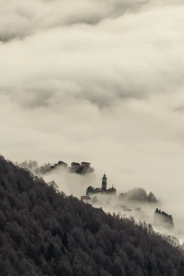 Fog, covering and uncovering the charming village of Pizzino di Taleggio. thumbnail