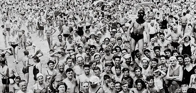 Weegee photo of masked man on Coney Island