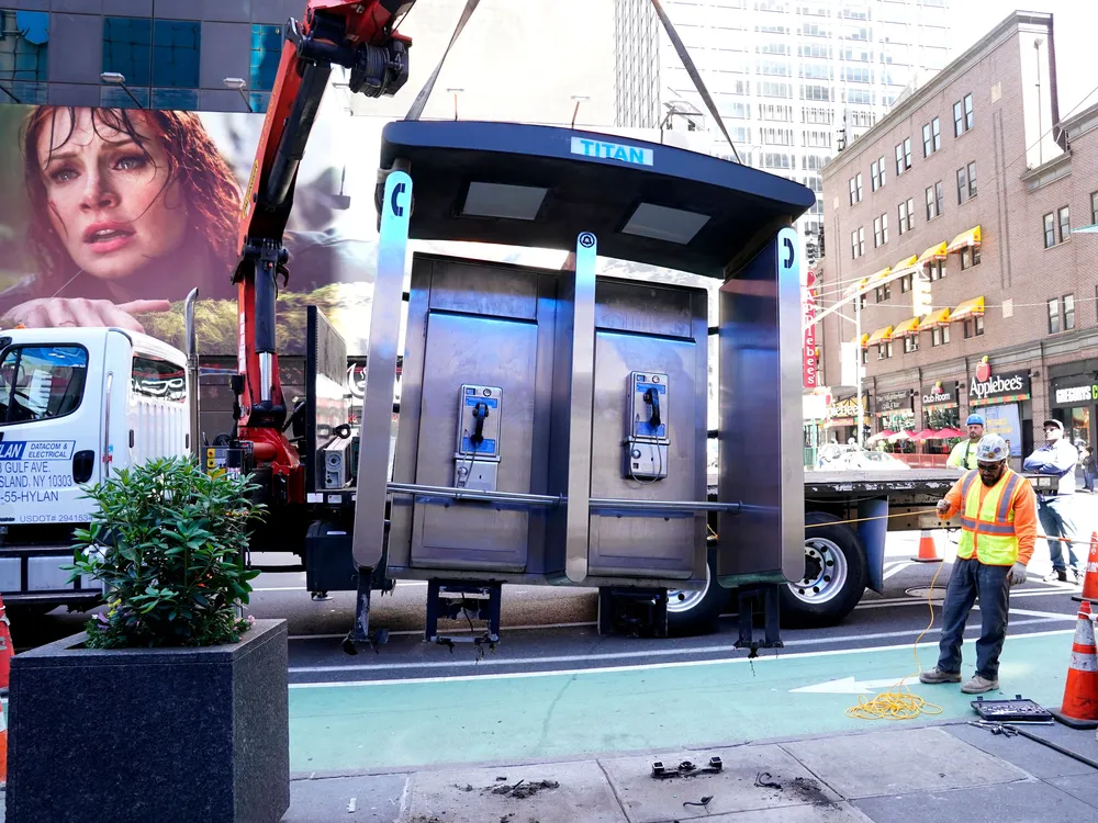 Payphone booth being removed