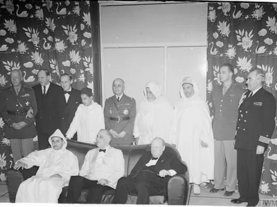 Mohammed (seated at left) with Franklin D. Roosevelt (center) and Winston Churchill (right) at a 1943 war conference near Casablanca