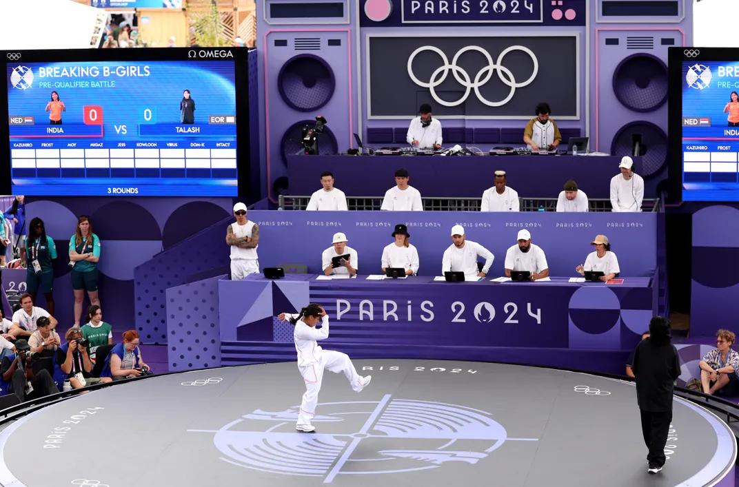 B-Girl India competes during the B-girls Pre-Qualifier at the Olympic Games Paris 2024 on a round stage