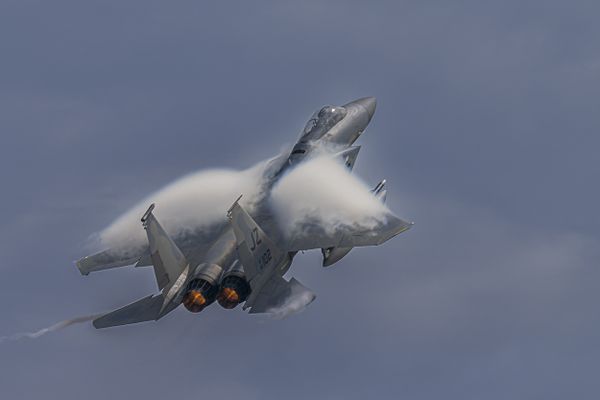 An F-15 fighter jet with "clouds" on Wings thumbnail