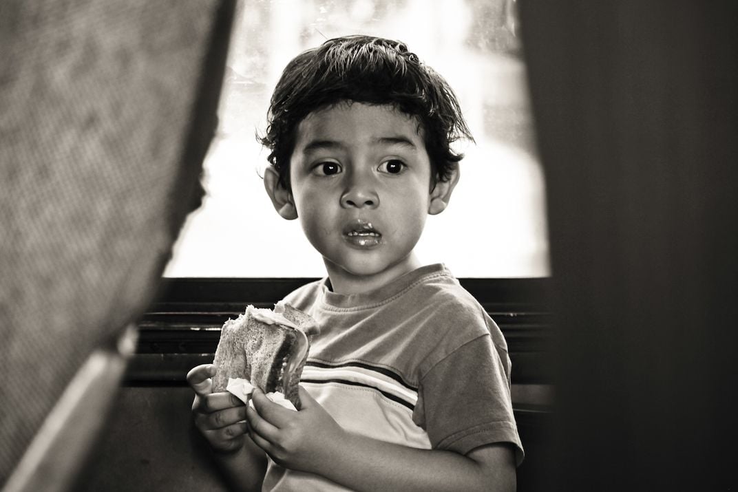 A young mexican boy traveling by bus from Mescales to Guadalajara ...