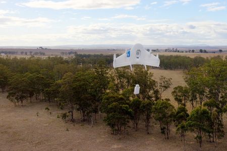 The Project Wing test craft begins lowering its payload during a test flight in Australia.
