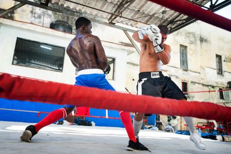 Two boxers spar in the ring in the outdoor gym Gimnasio de Boxeo Rafael Trejo in Old Havana, Cuba.