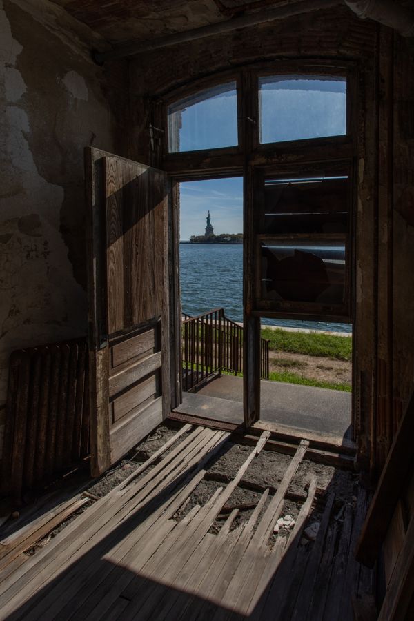 View of the Statue of Liberty from inside Ellis Island Hospital thumbnail