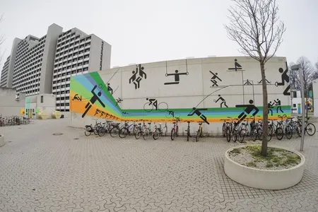 A mural in Munich's former Olympic Village features Otl Aicher's pictograms.