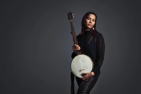 Giddens with her beloved cherry, maple and rosewood minstrel banjo, a replica of a design by the 19th-century Baltimore luthier Levi Brown.