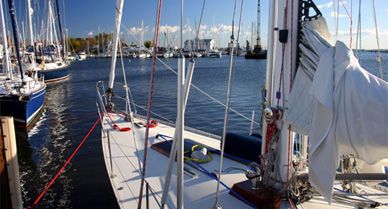 A sailboat floats at the dock