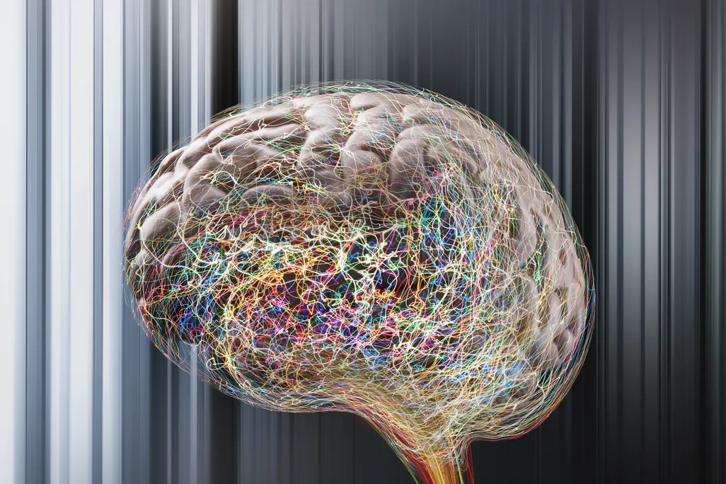 An artist's digital depiction of colorful, squiggly lines representing brain activity around an image of a brain