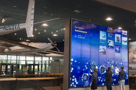 The 16- by 12-foot interactive wall is part of the National Air and Space Museum's new GO FLIGHT digital experience. Visitors to the Mall location can use the wall to create a personalized tour of artifacts. 