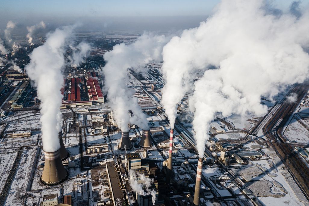 Smoke stacks of a coal fired power plant in China during winter