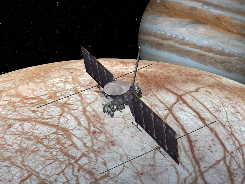 Artist's rendition of a spacecraft flying over Europa with Jupiter in the background