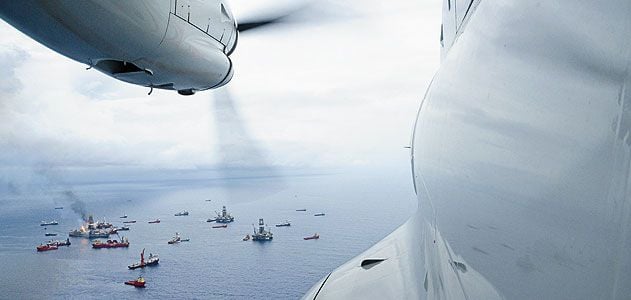 From the cockpit of a Coast Guard HC-144 patrol plane, the armada surrounding the deep water horizon rig last June appears placid.