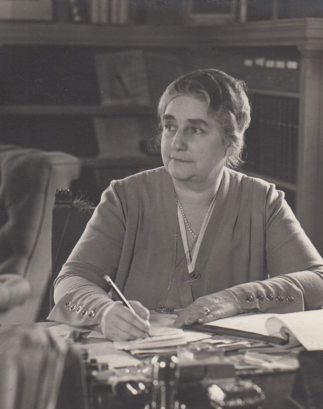 Mina at her desk in the Glenmont family living room in 1929