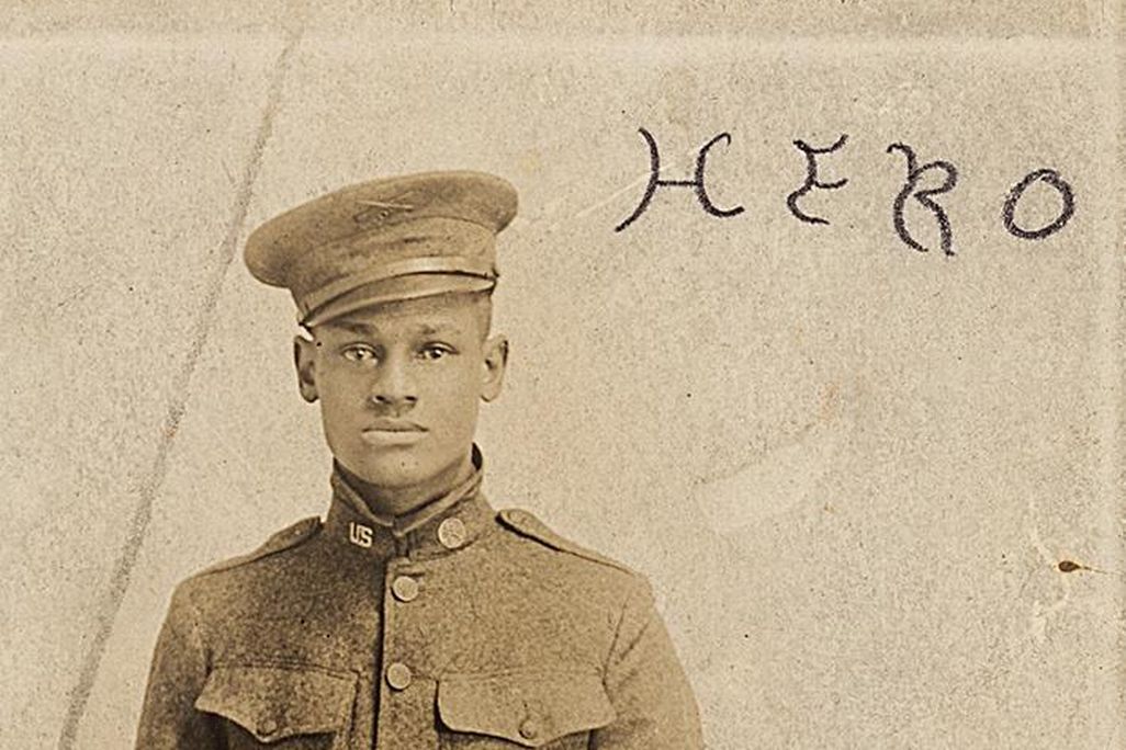 Cpl. Lawrence McVey poses at attention in a photographic postcard. 
