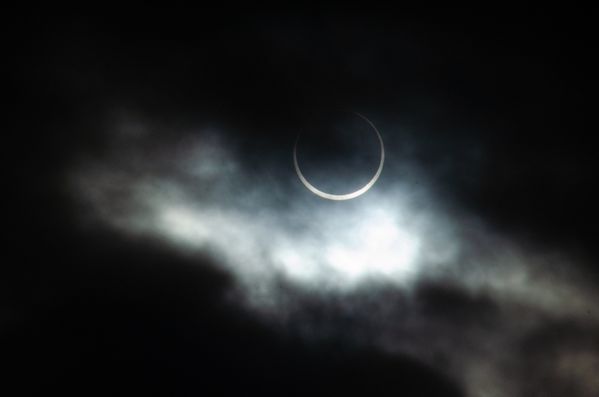 A solar eclipse through the clouds thumbnail