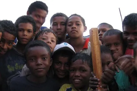 Children pose for the camera in El Pozon, a slum on the outskirts of Cartagena.