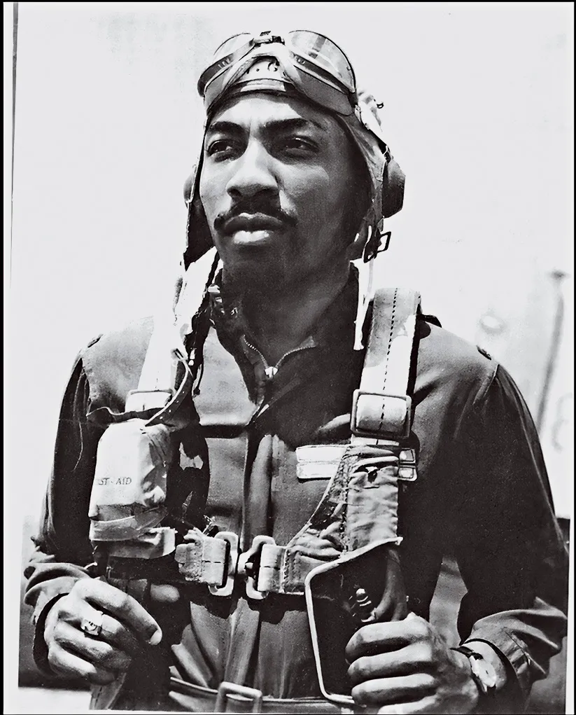A Black pilot posing for a photograph
