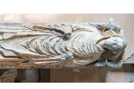 The statue, which dates back to around 1348, likely depicts John de Belton, a priest who died of the Black Death. 