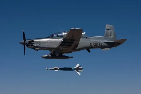 A Beechcraft AT-6, dropping a 500-pound bomb during 2011 tests.