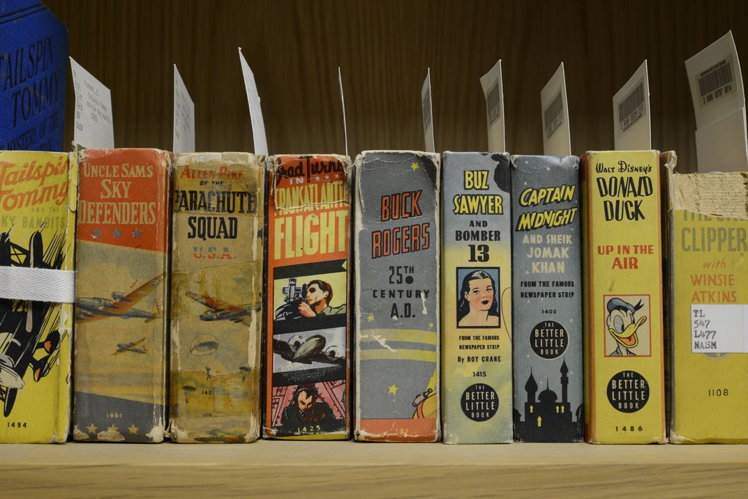 Photograph of juvenile aviation book spines on library shelf. 