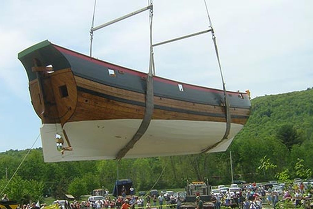 The Onrust being placed in the Hudson River