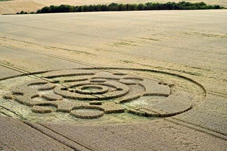 Crop circles are seen by many to enchant a mystical landscape: here, a circle pattern from 2009, 200 feet across, in a Wiltshire wheat field.