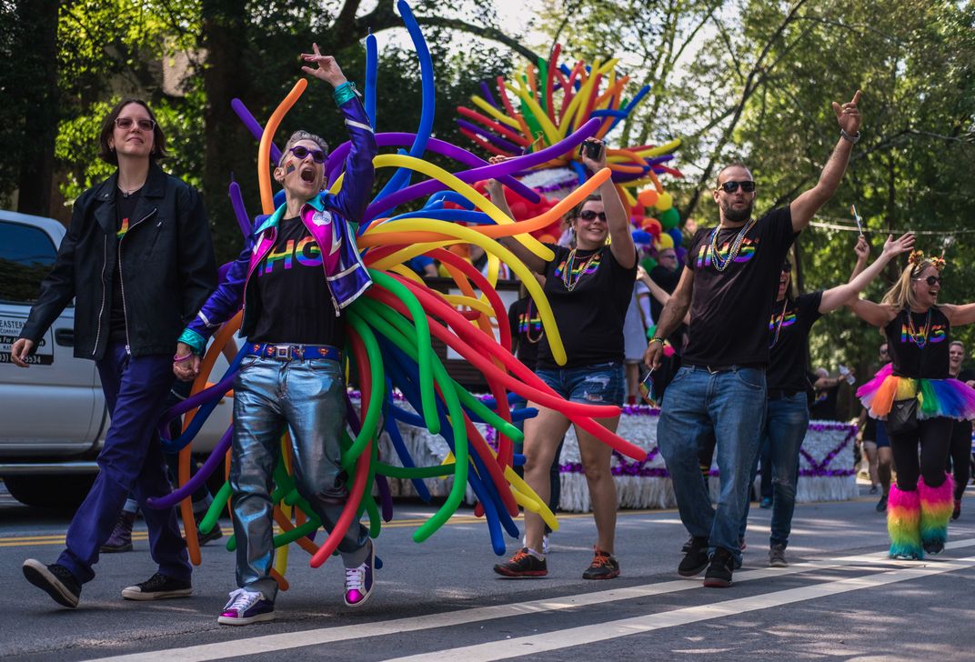 Couple empowers while marching in ATL pride parade. Smithsonian Photo