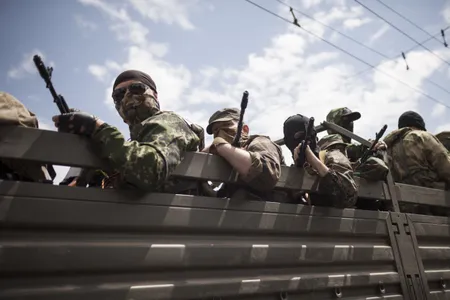 Armed militiamen from the pro-Russian Vostok Battallion took part in a rally held in Lenin's square, Donetsk, against Ukraine's presidential elections being held across the country.
