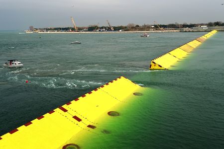 The barriers are designed to stay at the bottom of the lagoon until they are activated, fill with air and rise to the surface to seal off the lagoon's inlets.