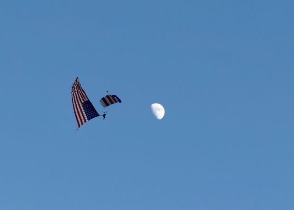 American Flag Skydiver Next to Moon on July 4th thumbnail