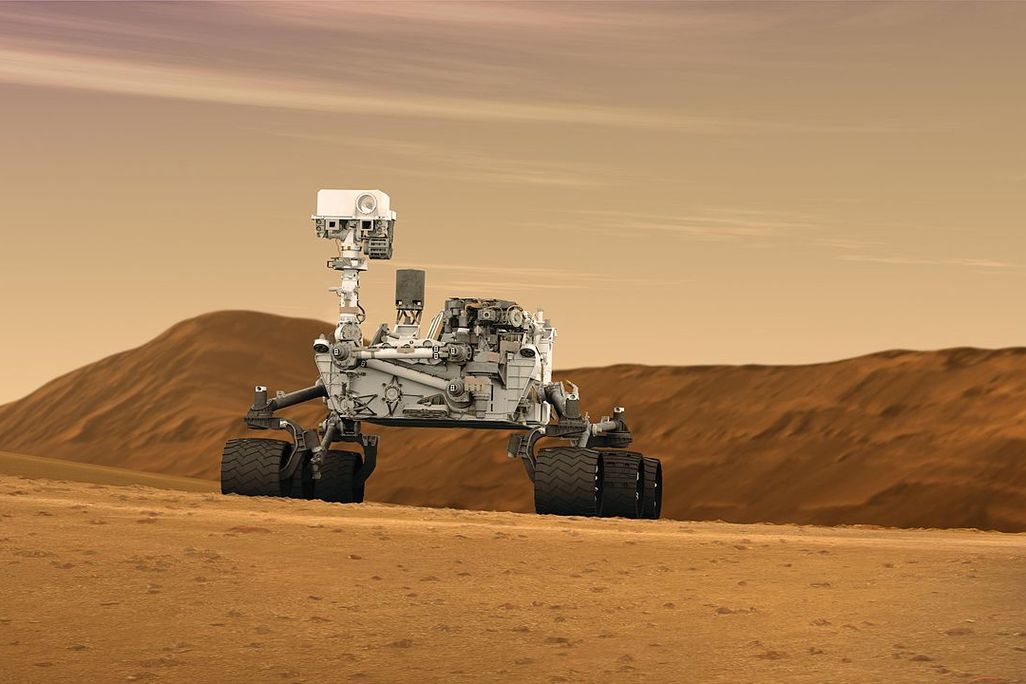 1280px-Mars_Rover_Curiosity_in_Artist's_Concept,_Wide.jpg