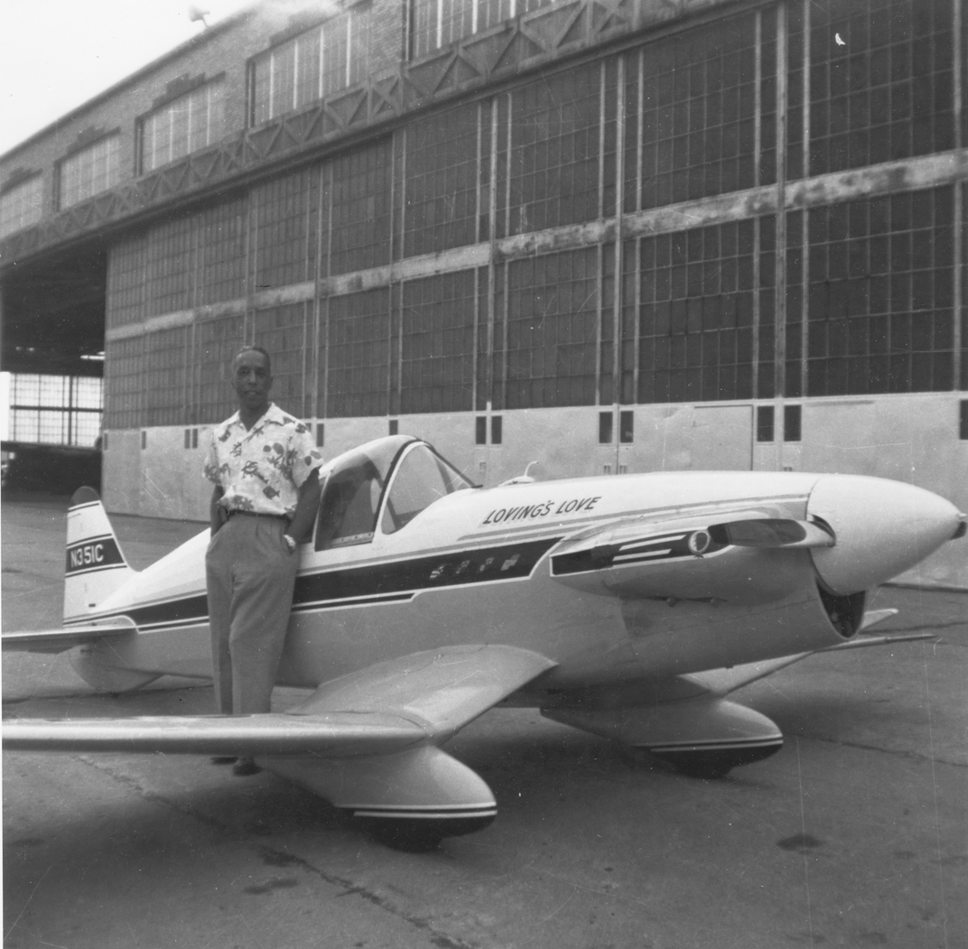 Loving poses next to his Loving's Love aircraft between the late 1950s and early 1960s