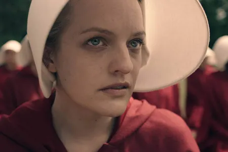Elisabeth Moss dons the iconic red robe and white bonnet of the handmaid for the new series debuting April 26.