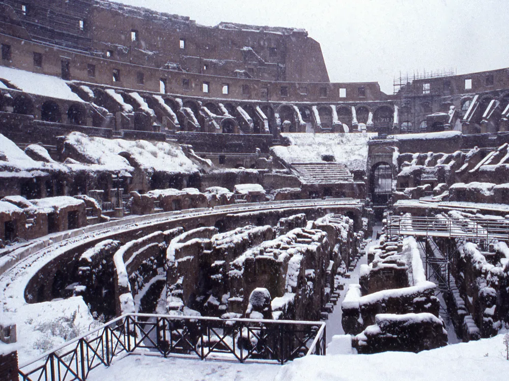 Snow covering interior of the Colosseum in Rome