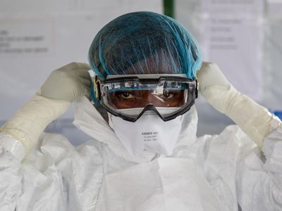 A nurse suits up in Liberia before entering an Ebola red zone in 2015. Now, a single case of Ebola has been confirmed in Congo by the World Health Organization. 