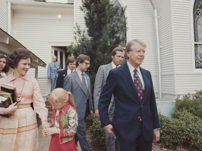 Presidential candidate Jimmy Carter with his wife, Rosalynn, and their daughter, Amy, exit the Baptist church in his hometown of Plains, Georgia, in 1976.