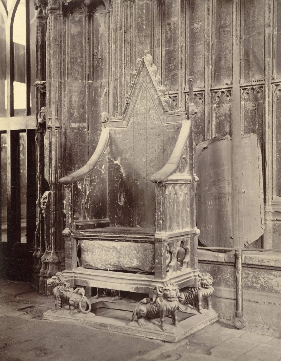 A late 19th-century photograph of the Coronation Chair, with the Stone of Scone visible below the seat