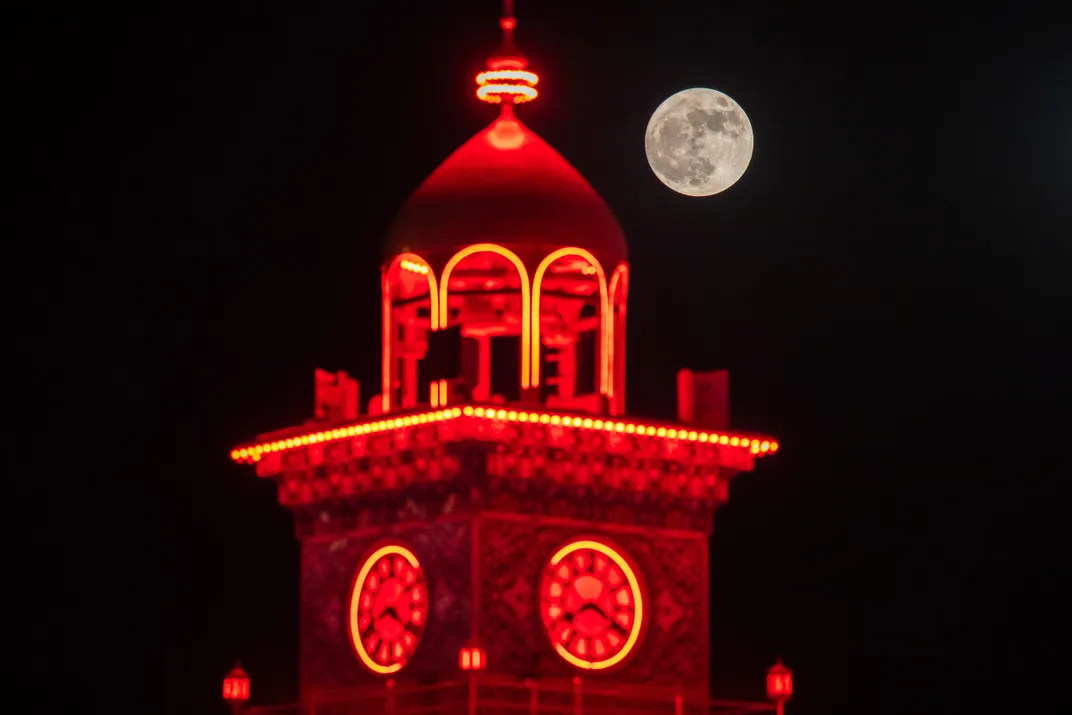 Strawberry moon appears in the evening sky over the Imam Ali Shrine in Najaf, Iraq, on June 29, 2026