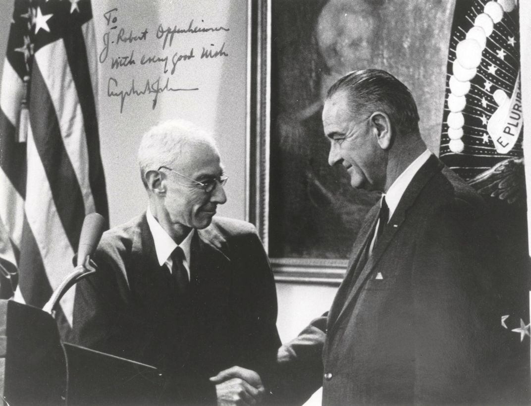 President Lyndon B. Johnson presents Oppenheimer (left) with the Enrico Fermi Award in 1963.