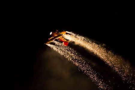 For his unforgettable night shows, aerobatic pilot Gene Soucy adds fireworks to all four wingtips of his Grumman ShowCat.