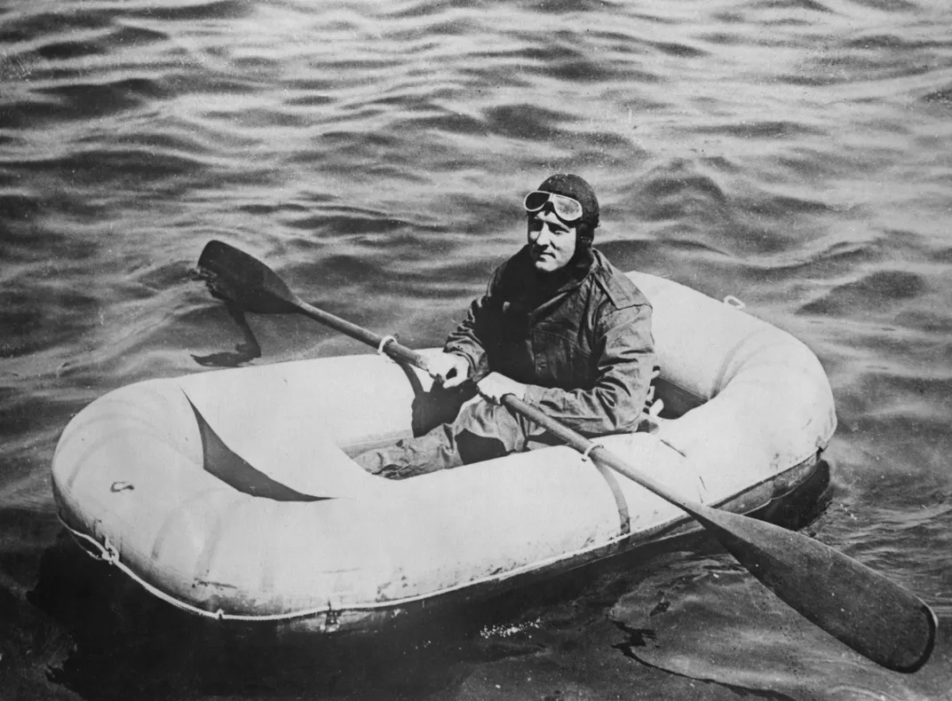 Byrd tries out a rubber dinghy in Washington, D.C. before his expedition to the Arctic, circa 1925
