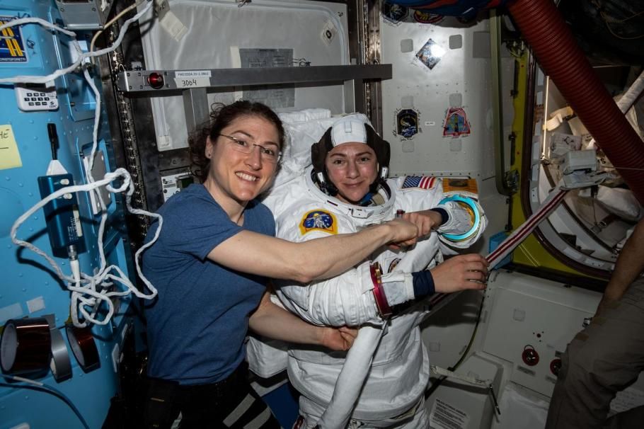 Christina Koch (left) poses for a portrait with Jessica Meir while preparing for their first spacewalk together. (Image courtesy of NASA)