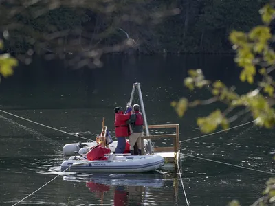 Scientists conduct sampling at Crawford Lake in Ontario, Canada, in April 2023. Last summer, a working group chose the lake as a representative location for the influence of human activity on the planet due to the history recorded in its sediment.