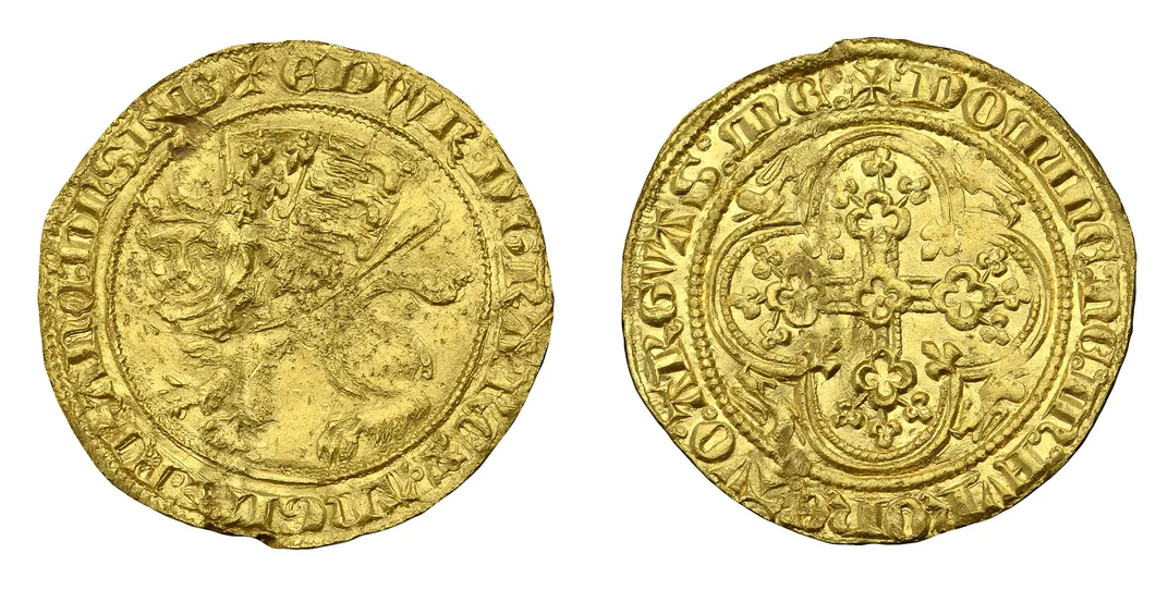 gold coin with stamped leopard and quartrefoil design