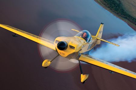 In 2011, smoke on and flying for the fun of it, David Martin climbs out over Possum Kingdom Lake, in his CAP 232.